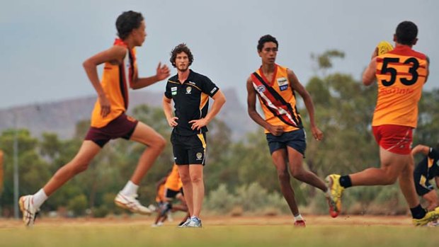 Ty Vickery watches Northern Territory Thunder players go through their paces during the Tigers' visit to Alice Springs this week.