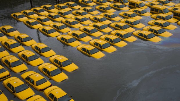 A parking lot full of yellow cabs  flooded in New York.