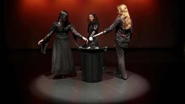 High School students from left, Martha De Ramos, Shoshana Lewis and Emily Bell playing the witches as they run through a scene in a production of <i>Macbeth</i> as part of the Bell Shakespeare Schools Festival during a rehearsal Calwell School Theatre.