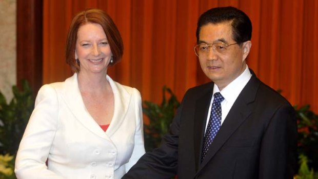 Julia Gillard shakes hands with Chinese President Hu Jintao earlier this year.