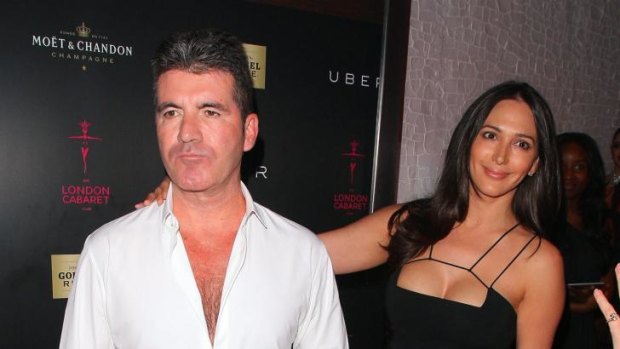Chest nut: Simon Cowell and Lauren Silverman at the opening of London Cabaret Club in May.
