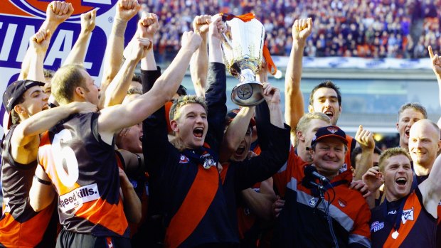 Bomber glory: Captain James Hird and coach Kevin Sheedy lift the 2000 AFL Premiership cup.