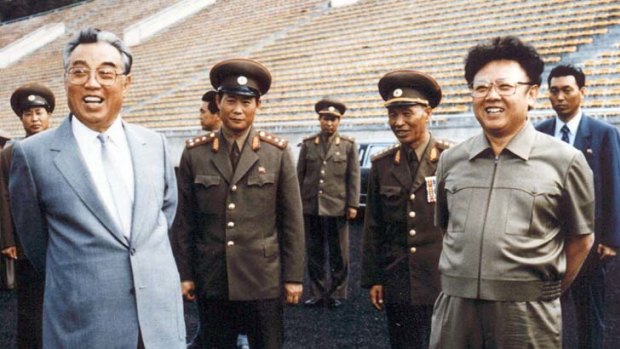 Kim Il-sung, left, and son Kim Jong-il inspect a Pyongyang stadium in 1992.