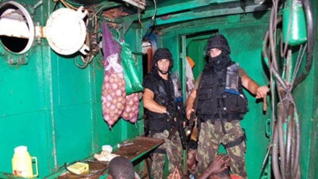 Captured...NATO troops from the Portuguese frigate Corte Real guard pirates whose attack on an oil tanker was foiled.