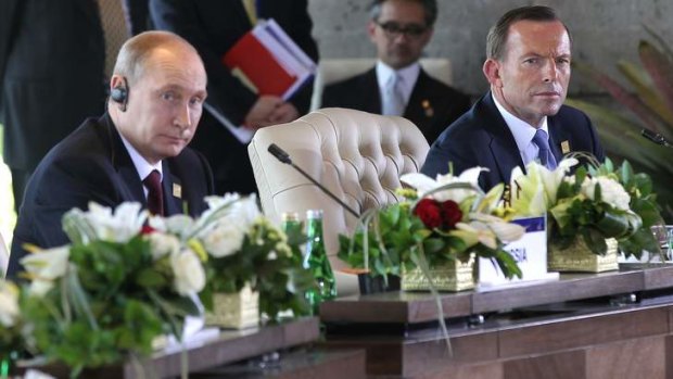 President Vladimir Putin and Prime Minister Tony Abbott during the APEC Economic Leaders' Meeting in Bali.