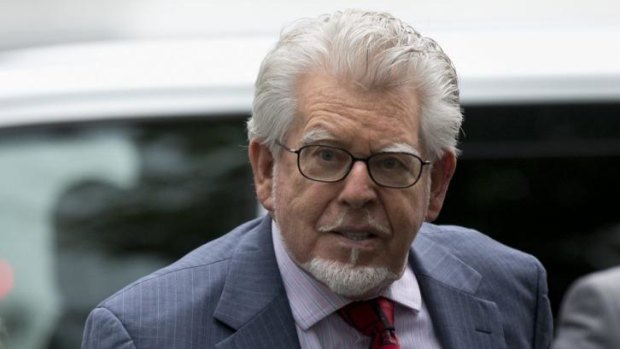 Veteran Australian-British entertainer Rolf Harris, who is accused of 12 counts of indecent assault, arrives at Southwark Crown Court in London.