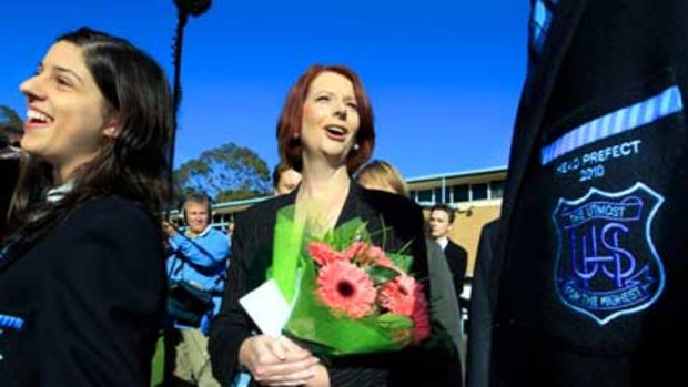 Prime Minister Julia Gillard chats to prefects during a visit to her old school, Unley High, in Adelaide.