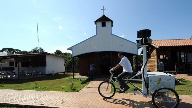 A Google team member rides a Trike with a 360-degree camera system on it, to record the "Street View for the Amazon" in Tumbira Community, Amazonas State.