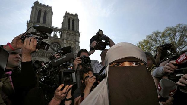 Defend ... Kenza Drider, a French Muslim of North African descent, wears a niqab outside the Notre Dame on the first day of the ban.
