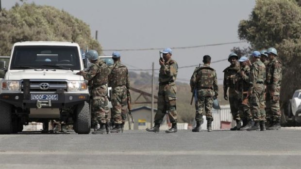 UN peacekeepers gather near the Quneitra crossing.