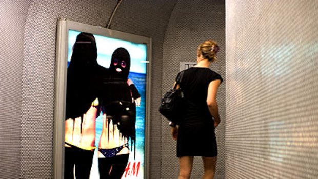 Hijabisation: Graffiti artist Princess Hijab targets high fashion advertising in the Paris metro.