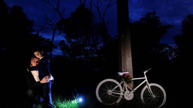 Jo and her son Ryan at the ghost bike site on Mount Eliza Road for Russell Myers, and a ghost bike is made ready.