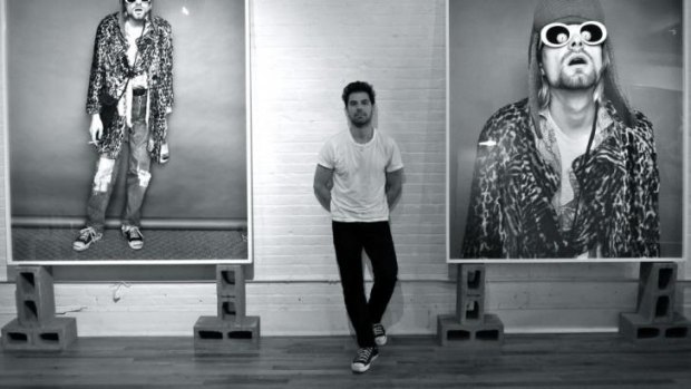 Photographer: Jesse Frohman with some of his portraits on display at Blender Gallery.