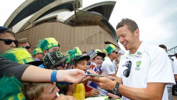 Fighting talk: Peter Siddle signs autographs at the Opera House on Tuesday. The fast bowler said Australia's pace attack was the best in world cricket.