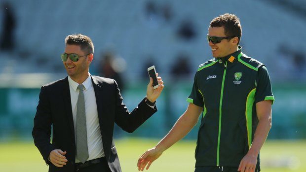 New role: Injured skipper Michael Clarke with  Peter Siddle on Boxing Day at the MCG. 