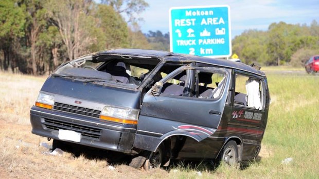 The damaged van on the side of the Hume Freeway.