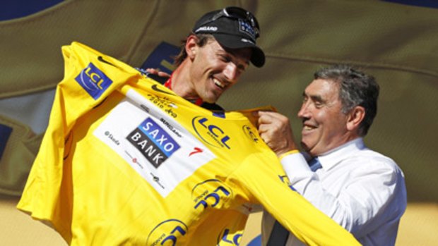 Fabian Cancellara celebrates holding onto the yellow leader's jersey in the Tour De France overnight.