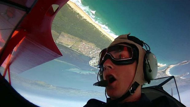 Sky high ... riding in the open-air cockpit of the Lilly Warra with pilot Chris Clark.