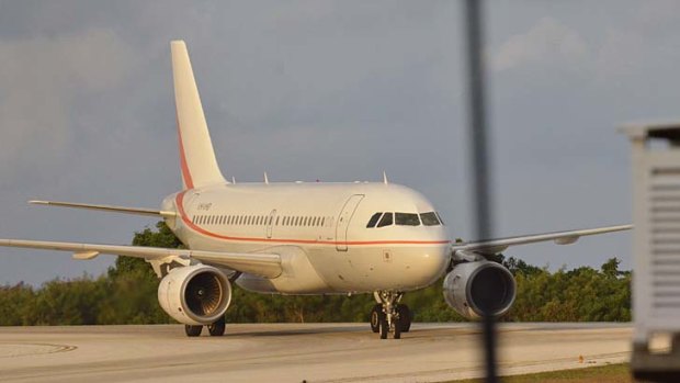 The first plane load of asylum seekers takes off for Nauru.
