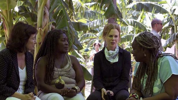 Help ... Nicole Kidman with the UN's Ines Alberdi and Haitians Yolette Jeanty and Daniele Magloire.