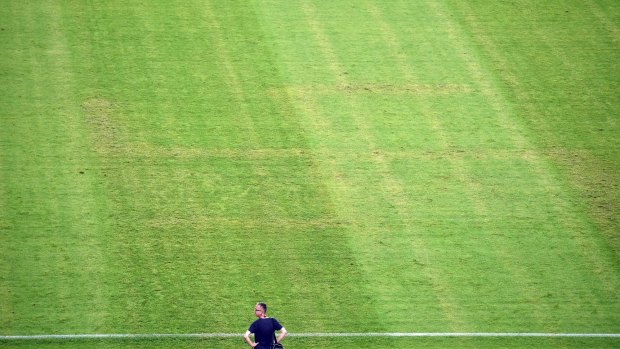 A man near the pitch showing the pattern of a swastika following the Euro 2016 qualifying match between Croatia and Italy  in Split.