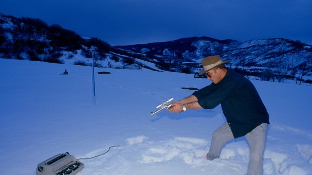 Hunter S. Thompson shooting his IBM typewriter in the Aspen snow. 