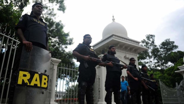 Polarised: Guards outside the high court in Dhaka on Thursday after a verdict was delivered disqualifying the Islamic party Jamaat-e-Islami from next year's elections.