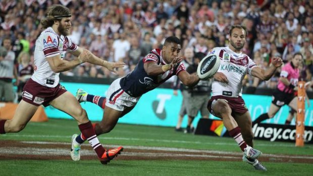 Match-winner: Roosters centre Michael Jennings shows no thought for self-preservation with his spectacular try in the grand final.