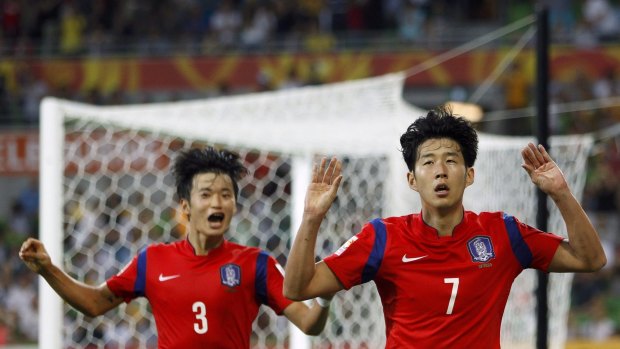 South Korea's Son Heung-min (right) celebrates his goal with teammate Kim Jin-su during their quarter-final against Uzbekistan.