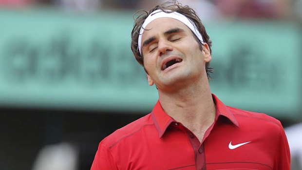 Lost again ... Roger Federer rues a missed return against Rafael Nadal.