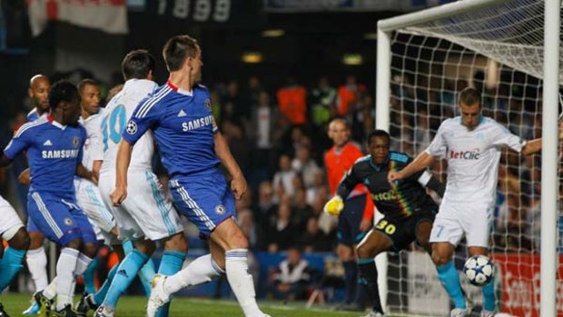 Opener ... John Terry flicks a low cross into the corner of the net during Chelsea's Champions League win over Marseille on Tuesday.