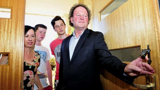 Liz Tilley and husband John Flannery with Conor Flannery, 15 and Patrick Flannery, 17 of Duffy were only able to salvage their door knocker from the 2003 Canberra Bushfires.