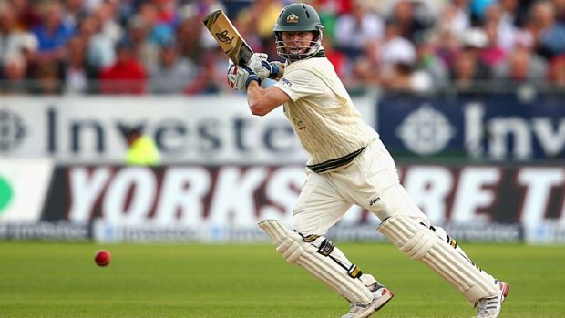 Opener Chris Rogers punches a ball into the covers during his unbeaten knock of 71 on day two of the fourth Test.