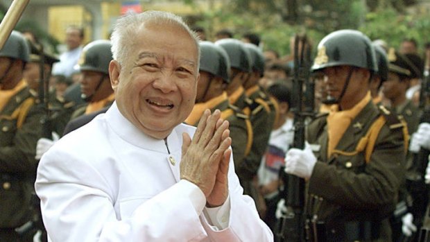 Cambodia's then King Norodom Sihanouk,79, greets his subjects upon his arrival at the annual crop-planting ceremony outside the royal palace in Phnom Penh.