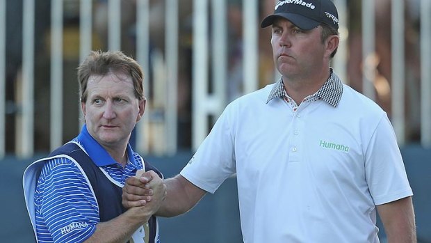 Bo Van Pelt had good reason to shake his caddy's hand after an epic birdie putt on the 18th hole on Saturday gave him a one-shot lead headed into the last round of the Perth International.