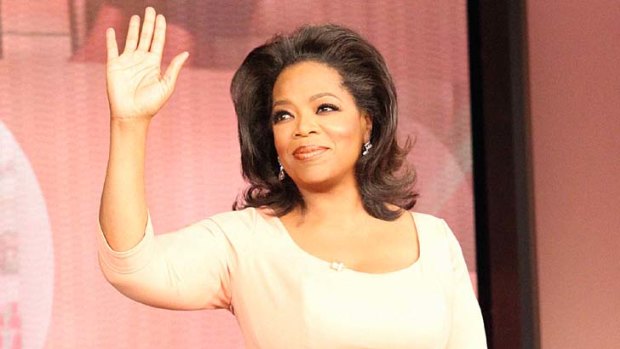 Waving goodbye ... Oprah Winfrey.