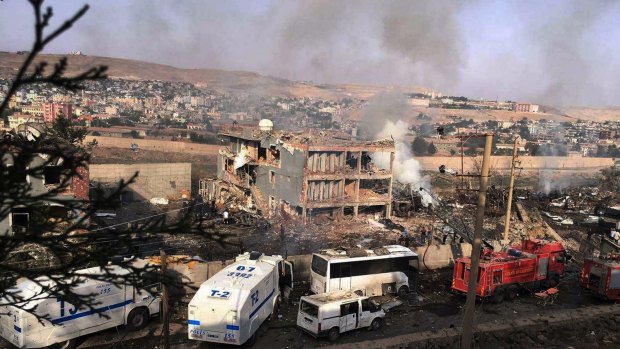 Smoke rises from the scene after Kurdish militants attacked a police checkpoint in Cizre, south-east Turkey on Friday.