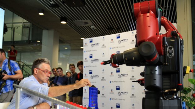 Professor Peter Corke, world-renowned roboticist with QUT's Science and Engineering Faculty and Director of the Australian Centre for Robotic Vision (ACRV), plays Connect Four with Baxter.