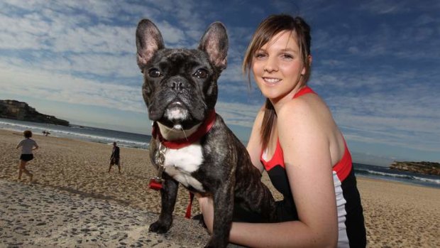 Rachael Anderson and Darci, a French bulldog, at the beach. A survey commissioned by the Animal Health Alliance found there were 4.2 million pet dogs in Australia.