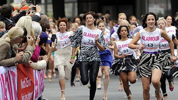 Women take part in the "Glamour Stiletto Run", in Berlin.