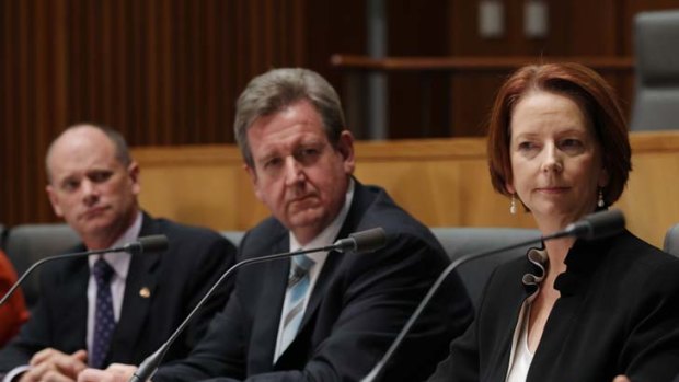 Question time ... the Queensland and NSW premiers, Campbell Newman and Barry O'Farrell, and the Prime Minister, Julia Gillard, at a post-COAG news conference.