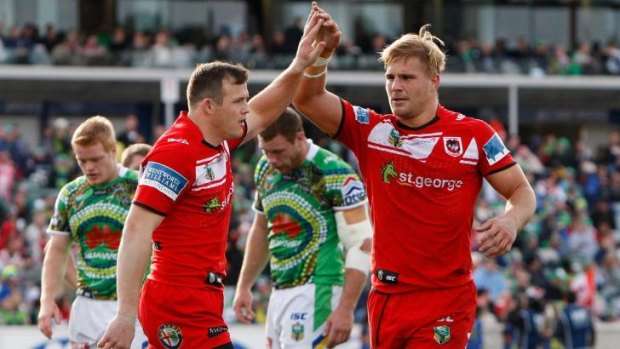 Brett Morris celebrates his try with Dragons teammate Jack de Belin.