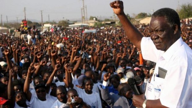 Then opposition leader Sata salutes supporters in 2006.