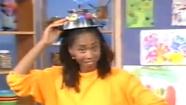 Trisha Goddard with a robot hat on Play School in 1991.