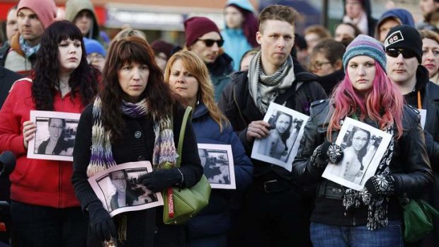 People hold photographs of 17-year-old Rehtaeh Parsons during a memorial vigil at Victoria Park in Halifax, Nova Scotia April 11, 2013.