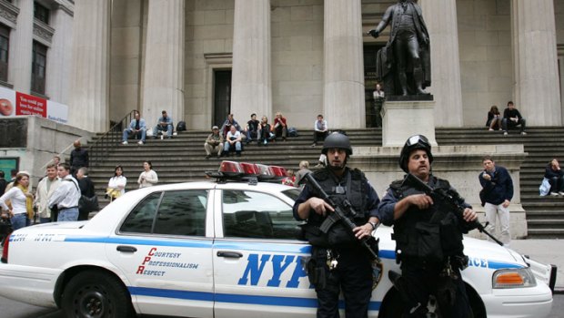 Armed police stand outside the New York Stock Exchange.