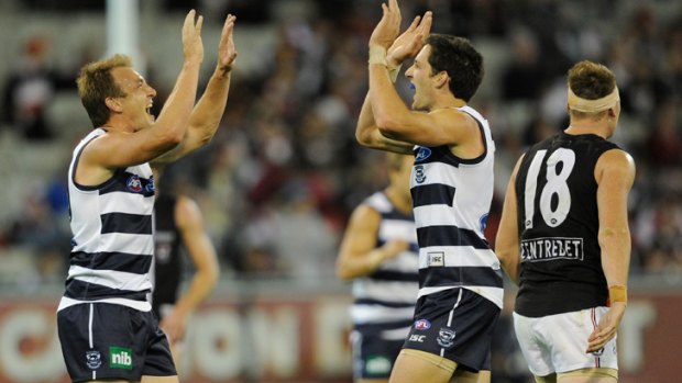 Changing stripes: Darren Milburn, with Harry Taylor, in his Geelong days.
