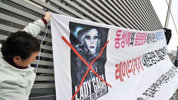 Members of South Korea's Alliance for Sound Culture In Sexuality with a banner protesting against Lady Gaga's concert in Seoul.