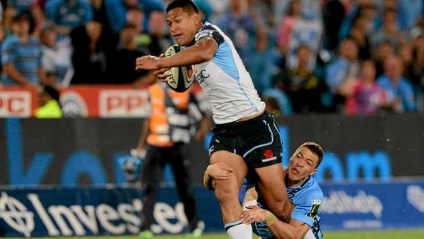 Put to the Test: Israel Folau is tackled by Bjorn Basson of the Bulls in Pretoria.