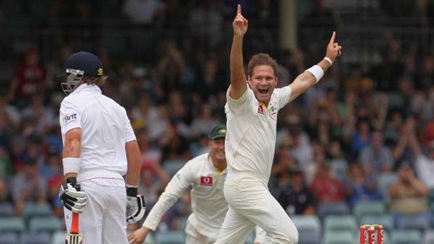 Ryan Harris of Australia celebrates after taking the wicket of Ian Bell.